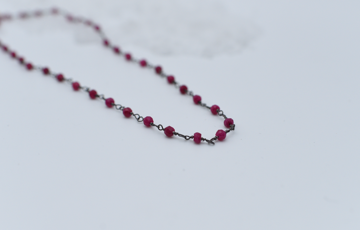 ruby and patina silver beaded chain.