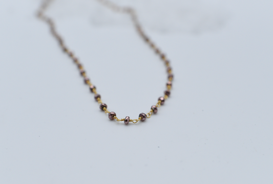 iridescent purple gold beaded chain. 18"