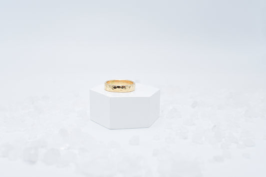 Wide hammered gold ring