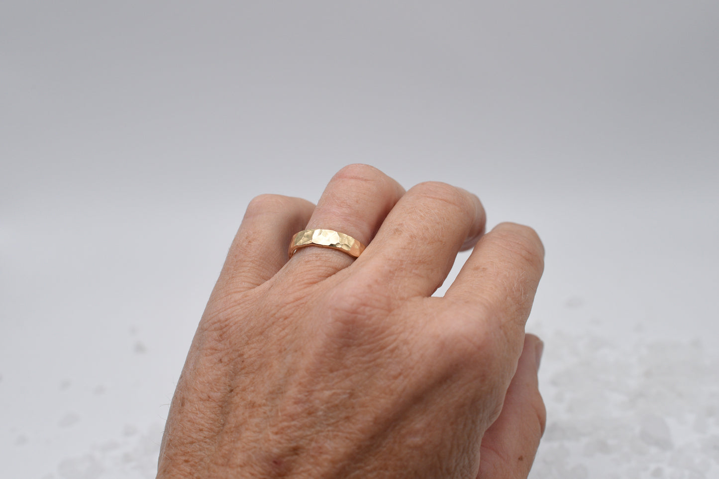 Wide hammered gold ring